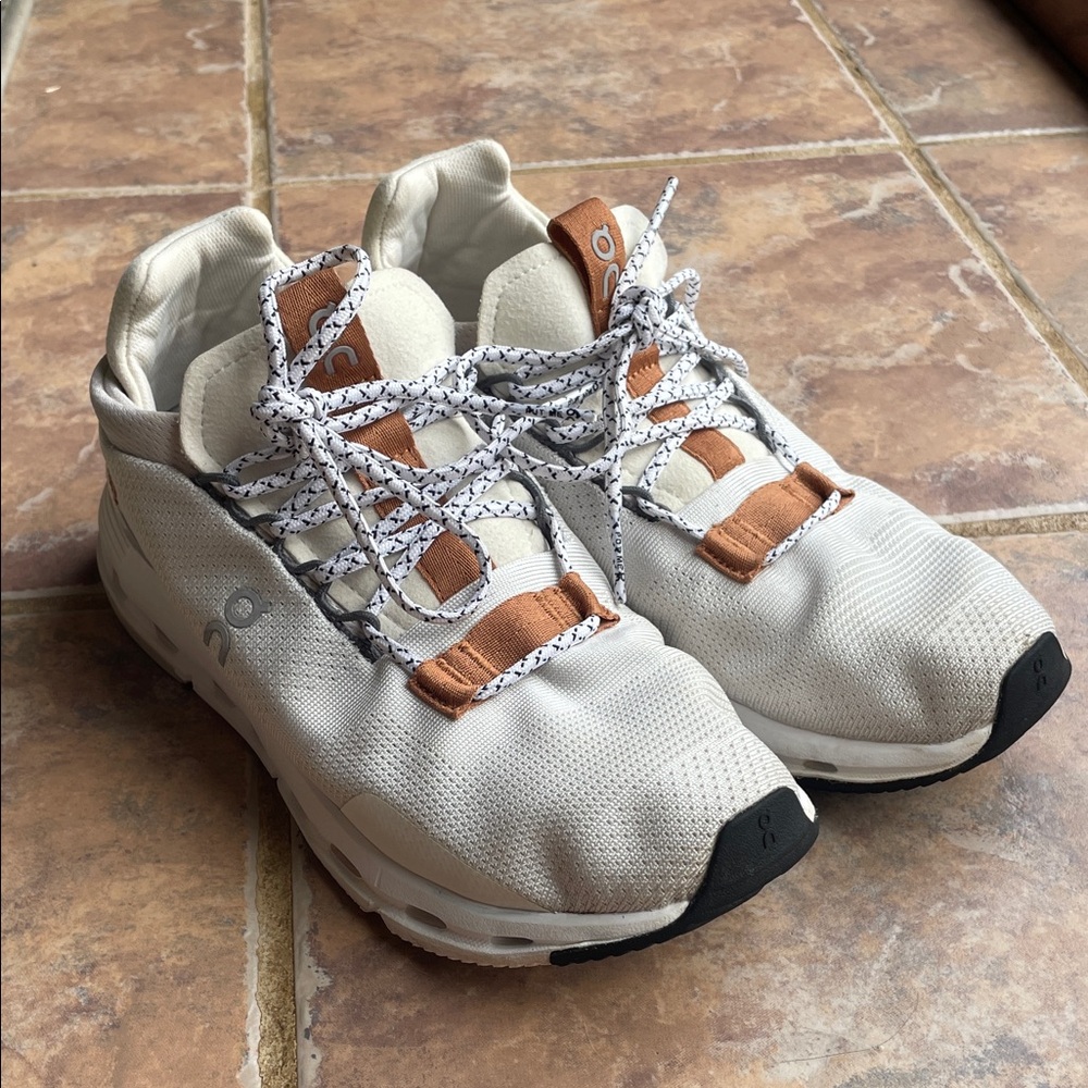 On Running White and Tan Athletic Shoes